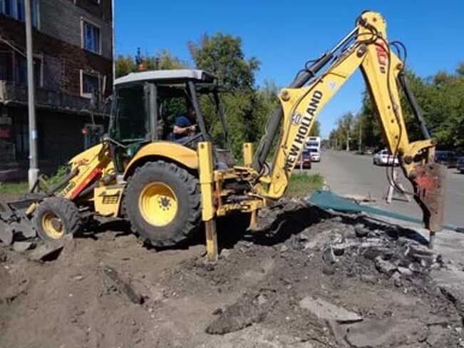 Аренда экскаватора-погрузчика New Holland B110B с гидромолотом